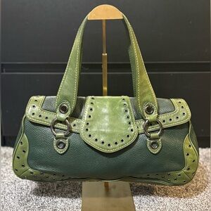 Michael Kors vintage two-tone green pebbled leather hobo with grommets.